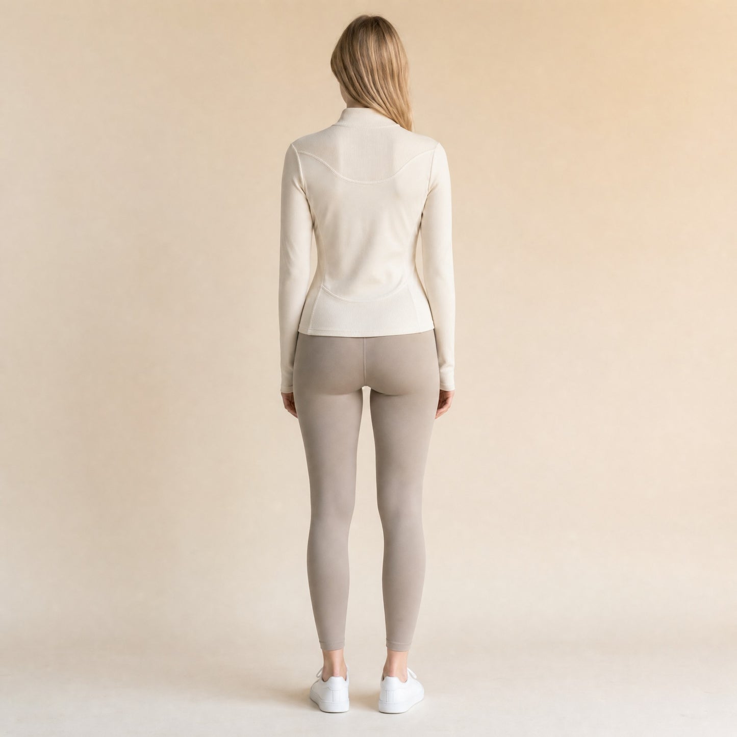 Slim-fit quarter-zip top, back view showing ribbed back yoke and princess-seam shaping