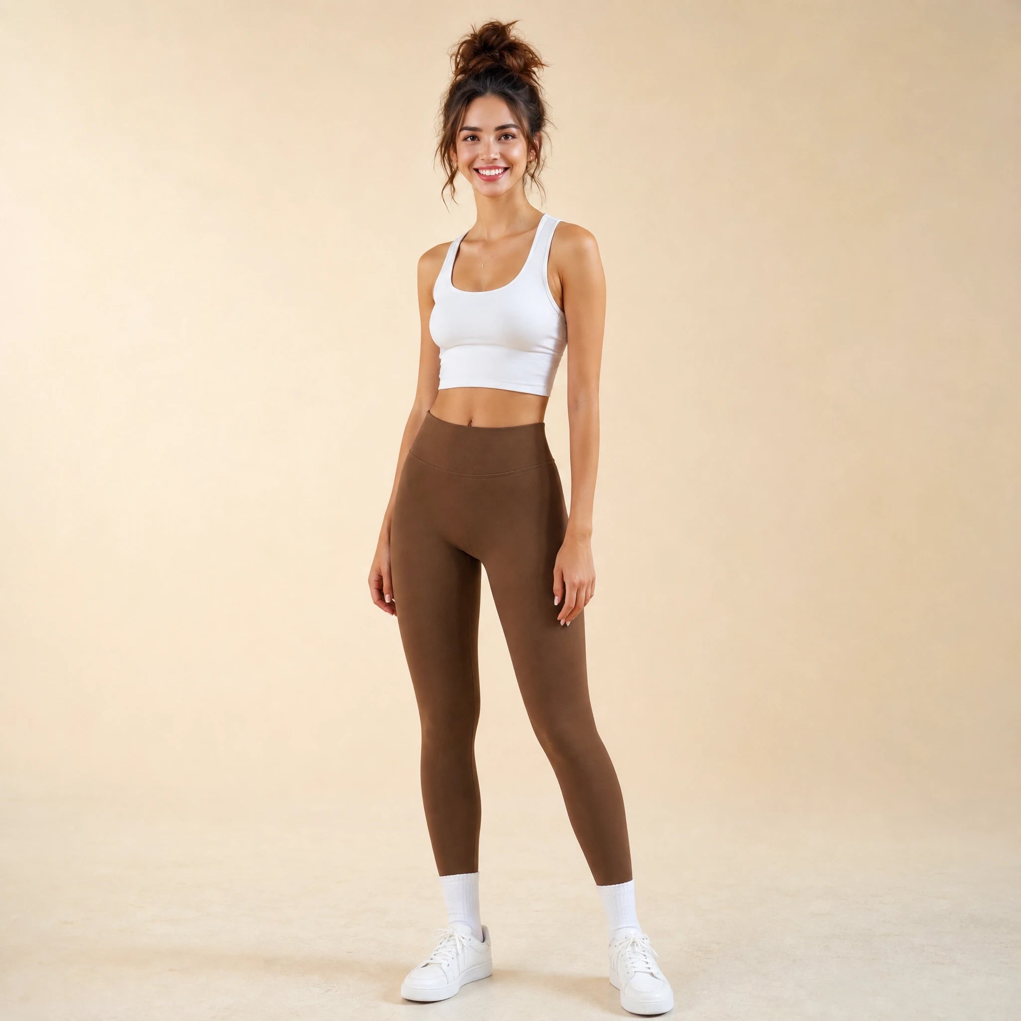 Woman in brown high-waist seamless leggings, full-length yoga pants, front view