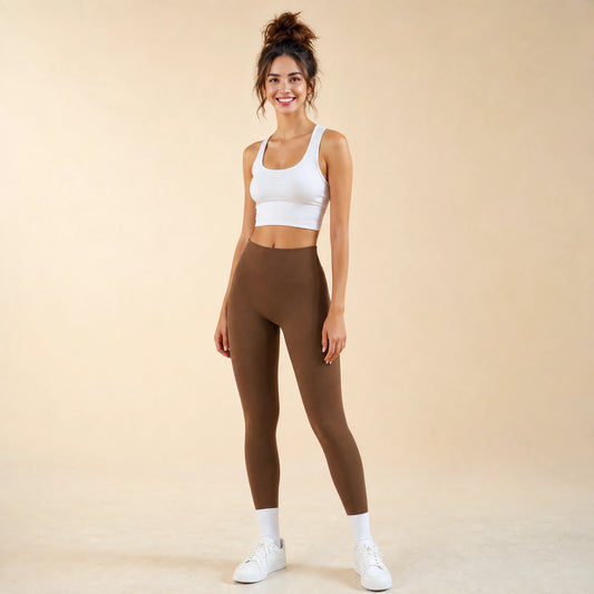 Woman in brown high-waist seamless leggings, full-length yoga pants, front view