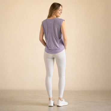 Open drape back with breathable mesh panel on MoxiSport women's yoga top