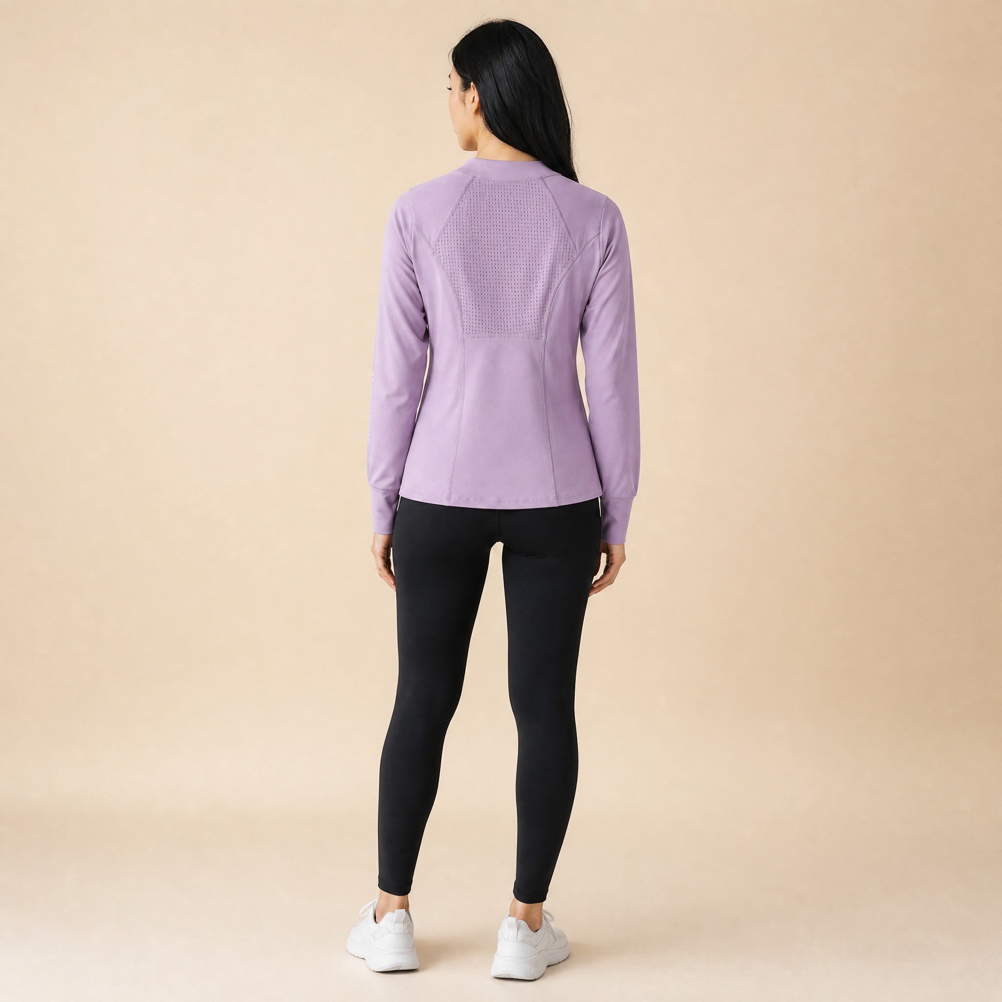 Lilac quarter-zip running top, back view showing the laser-cut mesh ventilation panel