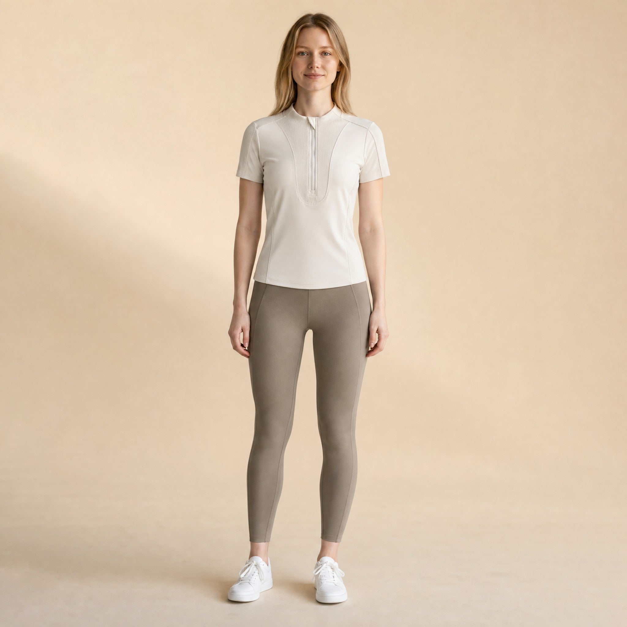 Women's quarter-zip mock-neck training top, front view slim fit short sleeve