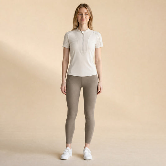 Women's quarter-zip mock-neck training top, front view slim fit short sleeve