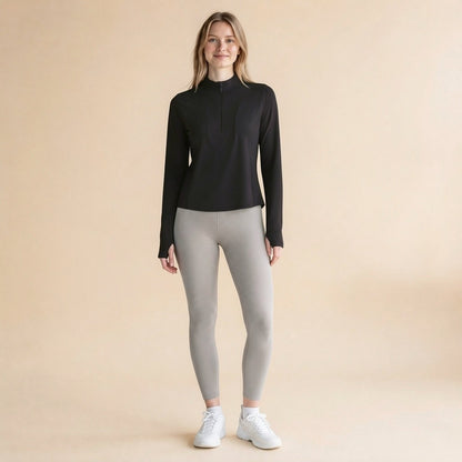 Black quarter-zip long-sleeve top with stand collar and contoured slim fit