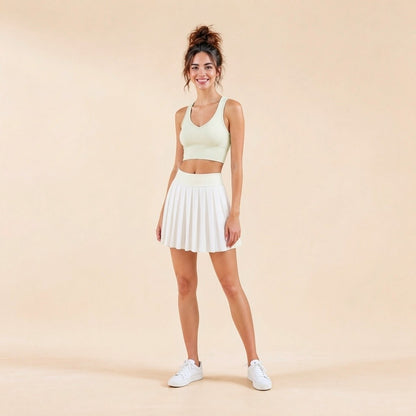 Women's V-neck seamless sports bra, front view with padded cups in cream