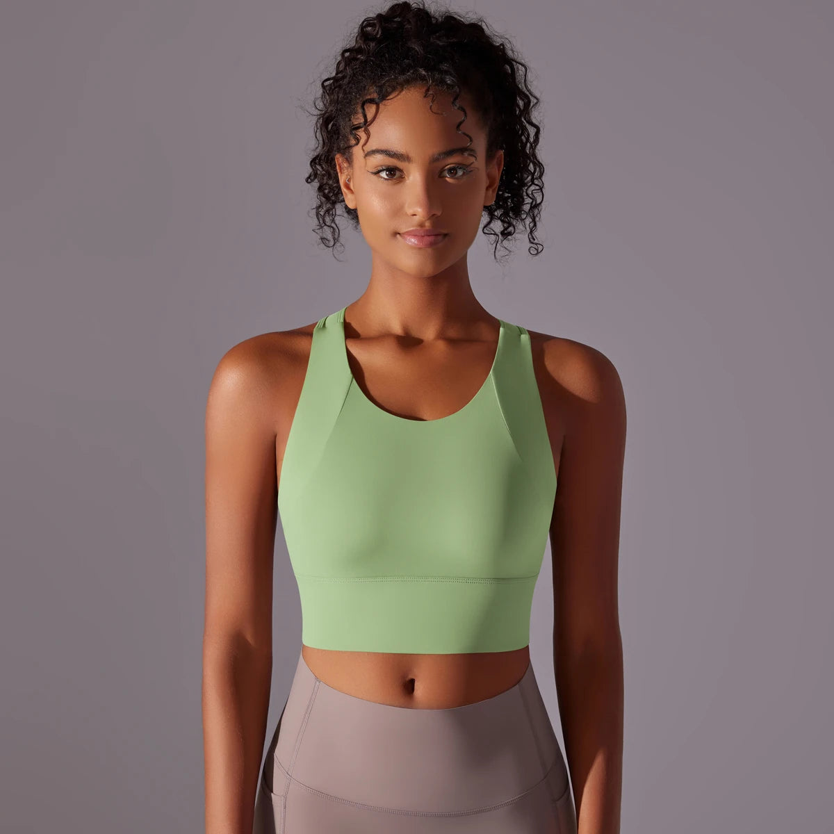 Women's padded crop sports bra – lifestyle yoga studio photo