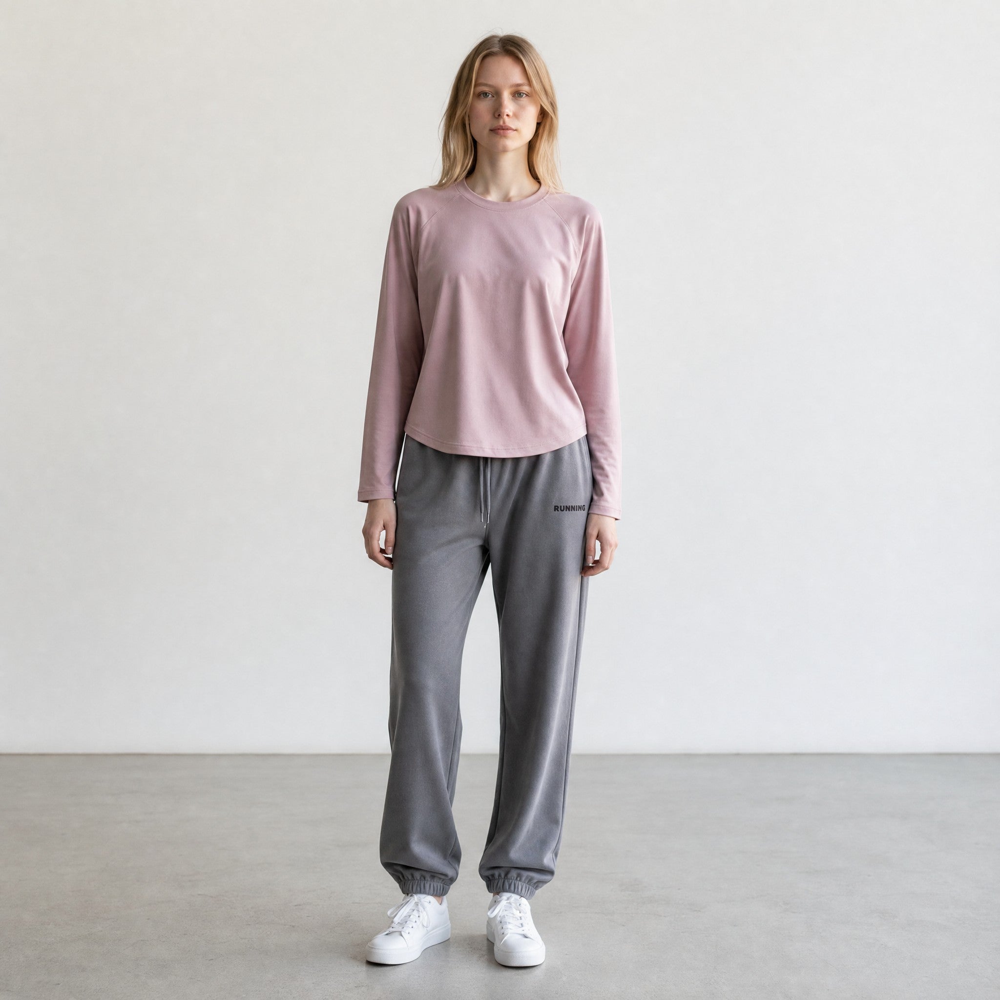 Women's two-piece activewear set – loose-fit long-sleeve graphic tee and joggers, front view