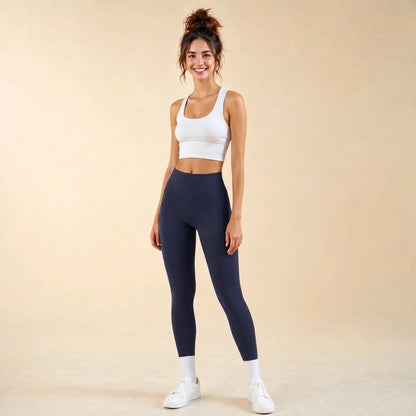 Woman in navy blue high-waist seamless leggings, full-length yoga pants, front view