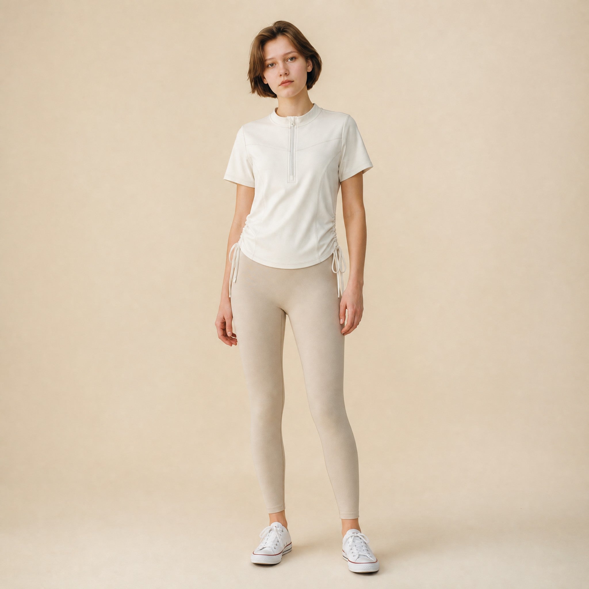 Women's quarter-zip side-drawstring workout top, front view short sleeve mock neck
