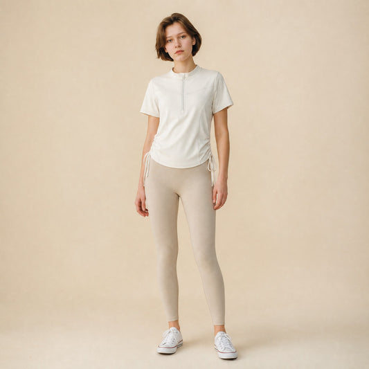 Women's quarter-zip side-drawstring workout top, front view short sleeve mock neck