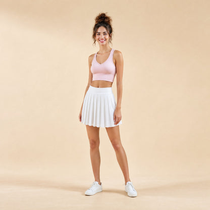 Women's racerback sports bra with V-neckline and padded cups in pink